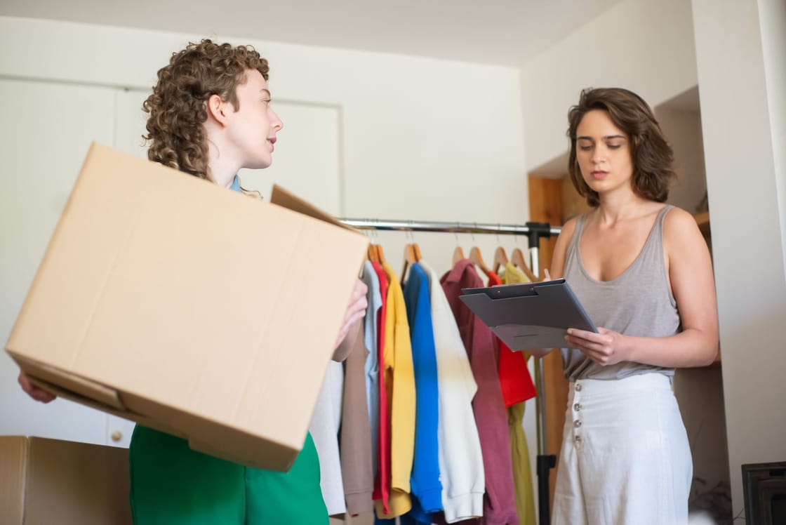 Two retailers organising clothes and packages for their online store