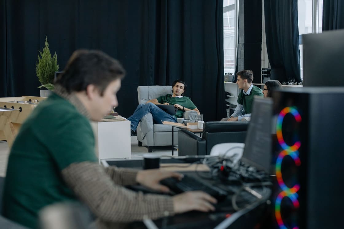 People working together on digital projects.