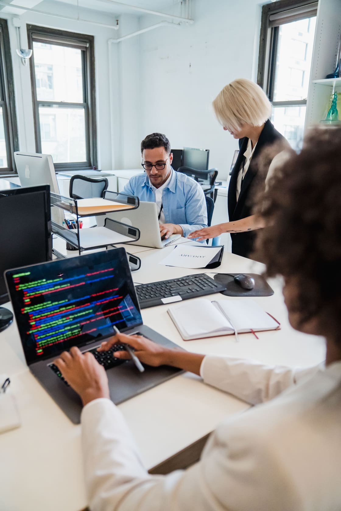 People collaborating on a software application.