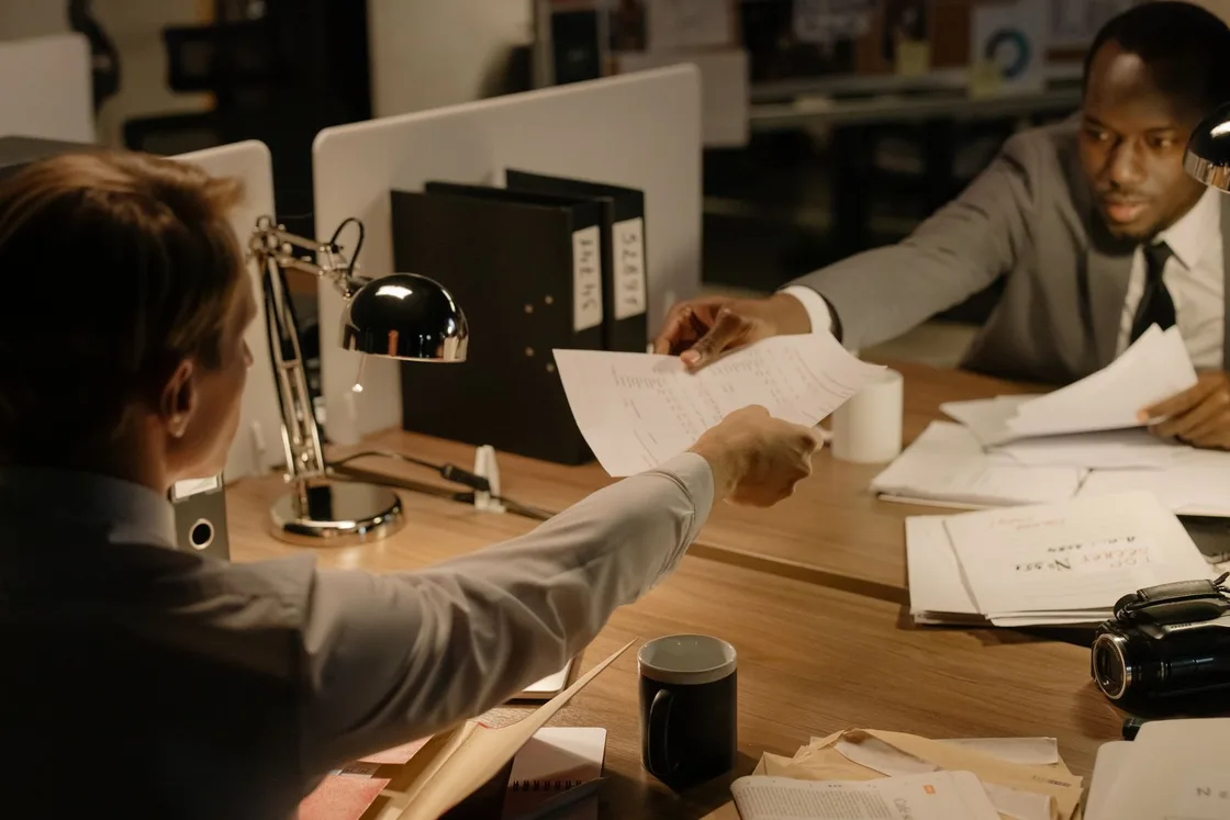 Illustrative photo · reviewing documents together